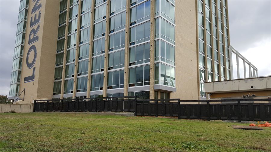 Metal fence in front of a commercial building